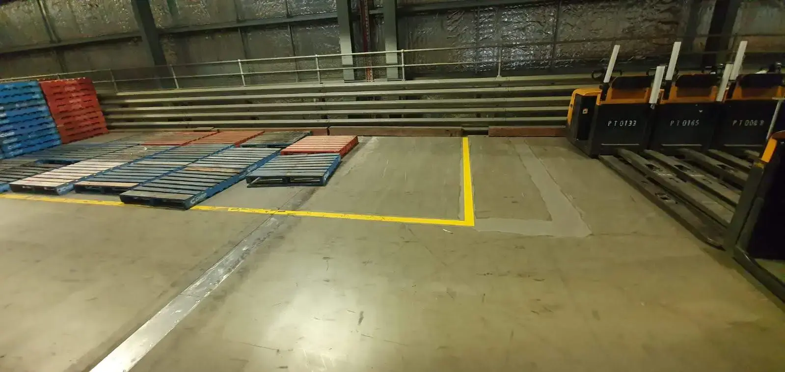 Old car park lines greyed out and repainted in a new layout