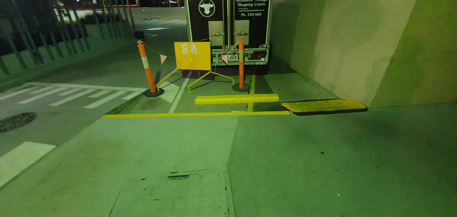 Wheel stops painted yellow to highlight the trip hazard