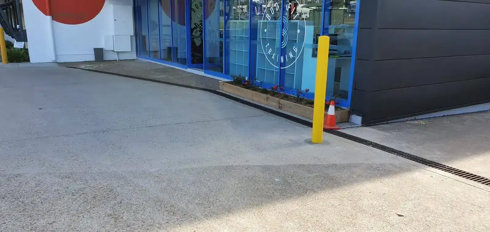 Bollards painted safety yellow in a car park