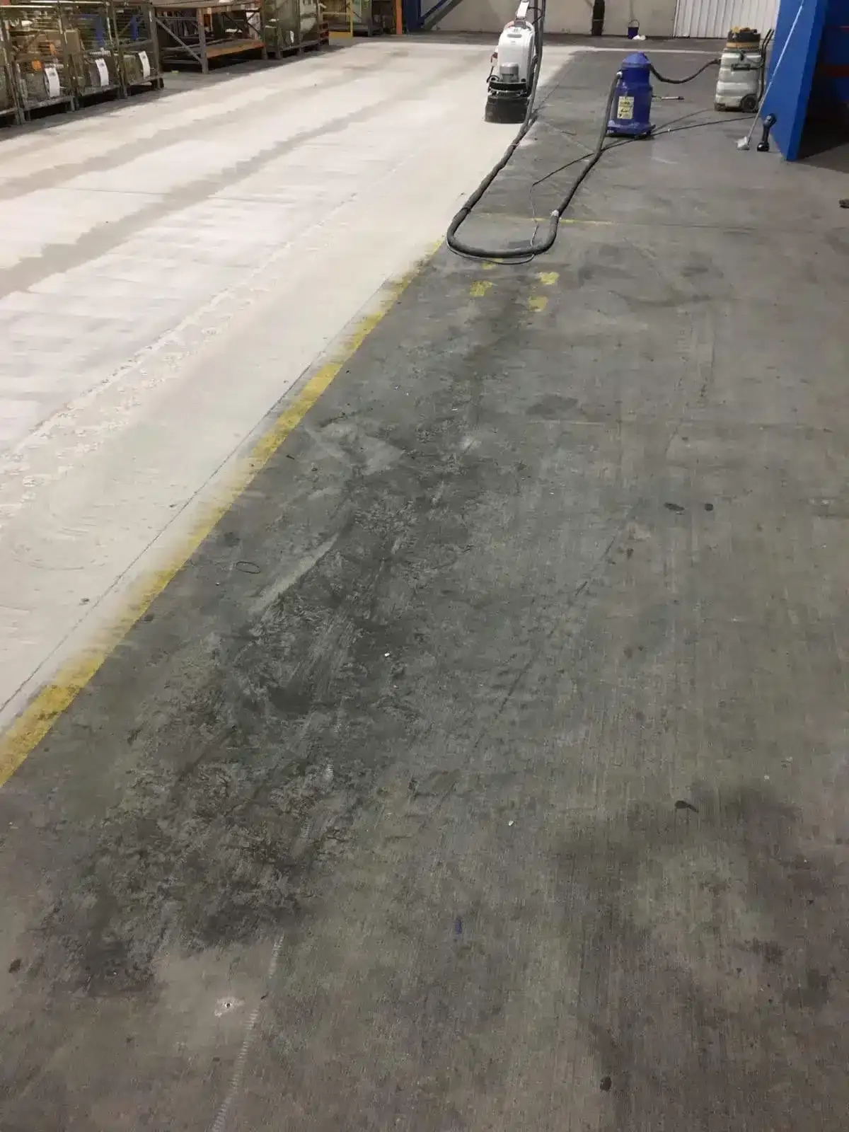Diamond grinding a factory floor in preparation for an epoxy coating